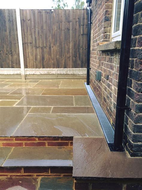Retro fitting aco drains against house. .